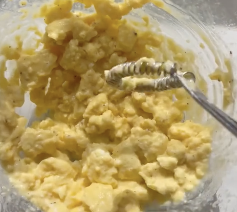 scrambled eggs on a whisk